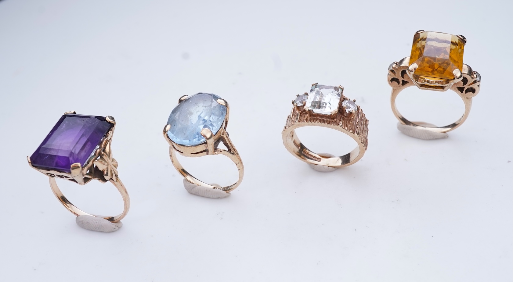 Four gem-set rings